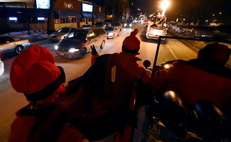 Vuicans wave from their fire truck during the parade. (John Autey / Pioneer Press)