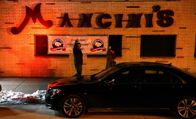 Vulcan fans wave at the Vulcan Krewe in front of Mancini's on West Seventh Street. (John Autey / Pioneer Press)