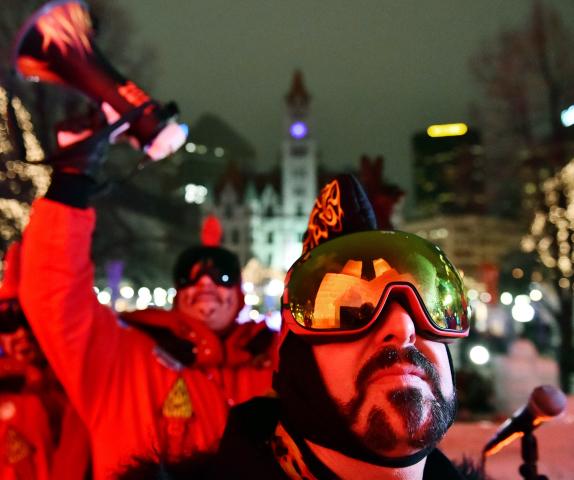 Vulcanus Rex LXXXI looks up at the red colored Ice Palace during the Vulcan "Hot Time In Rice Park" takeover. (John Autey / Pioneer Press)