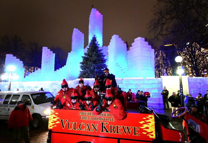 The 2018 Vulcan Krewe pose for a photo from atop their fire truck after being ejected from the St. Paul Winter Carnival Ice Palace in Rice Park in St. Paul on Friday Feb. 2, 2018. (John Autey / Pioneer Press)