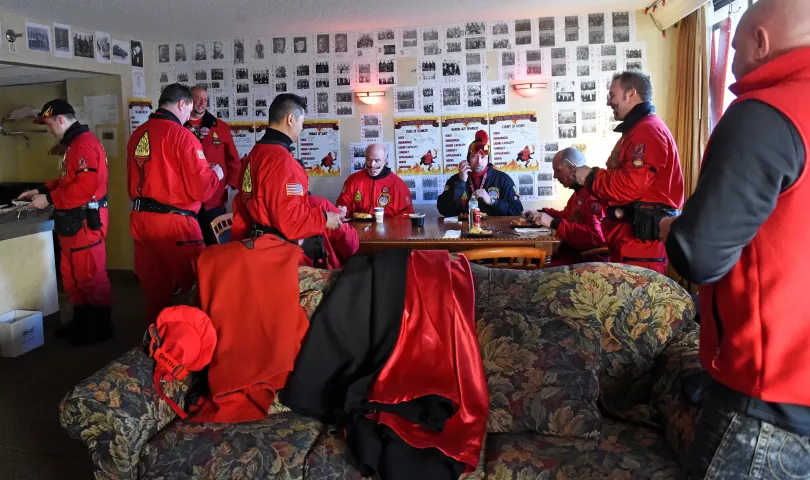 The Vulcans eat breakfast in their "den" before heading out to visit schools in St. Paul on Wednesday. Photos of past Vulcan Krewes line the walls. (Pioneer Press: Jean Pieri)