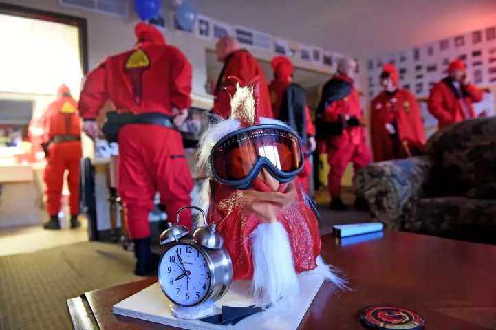 The Winter Carnvial Royal Court gave the Vulcan Krewe this clock so they don't oversleep. The rooster mask will be worn by the Royal Court Guard who will ride with them on Wednesday. (Pioneer Press: Jean Pieri)