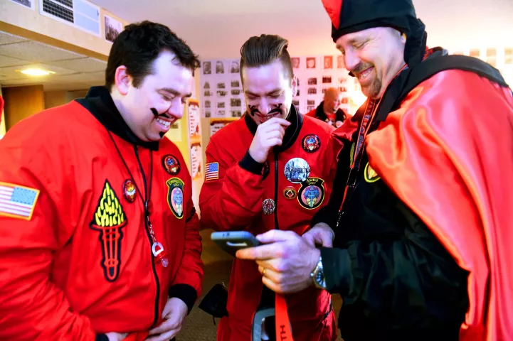Vulcans from left, Mike Schmidt, Count Embrious, Joshua Pelton, Count of Ashes, and David Breen, Vulcanus Rex laugh at a cell phone video taken the previous night of Pelton being tormented by Schmidt after falling asleep on the sofa in their den. (Pioneer Press: Jean Pieri)