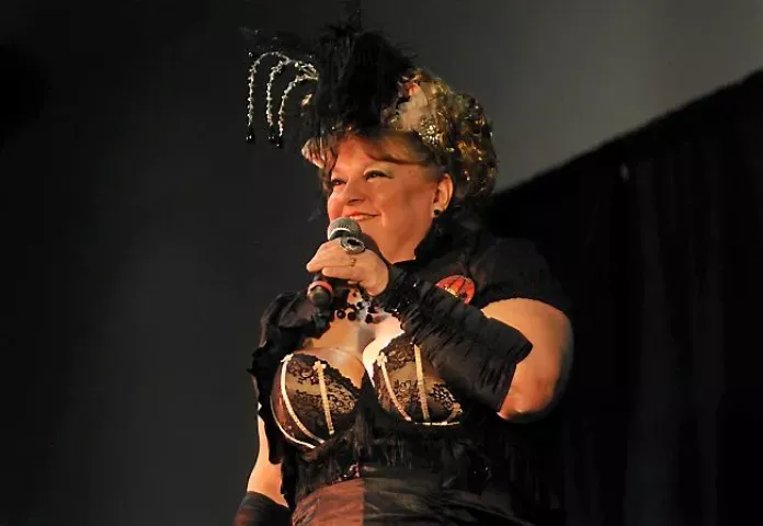 Shelley Brown of Inver Grove Heights belts out her rendition of “Who’s Going to Help Me Find My Place?” in the first round of the Klondike Kate competition, part of the 128th St. Paul Winter Carnival, held in Oakdale Wednesday night, January 8, 2014. (Pioneer Press: Scott Takushi)