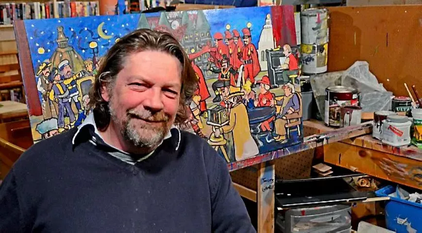 Woodbury artist Richard Hubal sits in front of his painting "The Tyranny of Tradition" on Wednesday, Dec. 31, 2014, in his home studio. (Special to the Pioneer Press: Juan Pablo Ramirez)