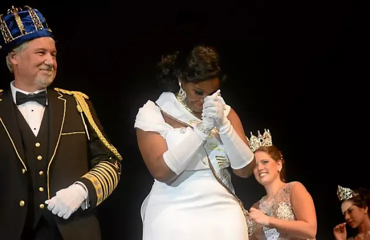 Krystle Igbo-Ogbonna takes a moment after being crowned Aurora, Queen of Snows during the St. Paul Winter Carnival Royal Coronation at the RiverCentre in St. Paul on Friday, January 23, 2015. Left of her is Boreas LXXVIX Daniel E. Stoltz. (Pioneer Press: John Autey)