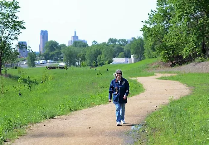 Linda Jungwirth, a member of the Tri Area Block Club, walks on one of the paths in the Trout Brook nature sanctuary in the North End neighborhood of St. Paul on Tuesday, May 27, 2015. Jungwirth and many others have been pushing for the sanctuary to open for decades. (Pioneer Press: Holly Peterson)