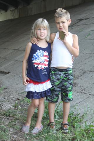 Lily VanBergen, 5, and brother Evan, 6, show off the prized Heimatfest medallion.  PHOTO BY RACHEL WITTROCK