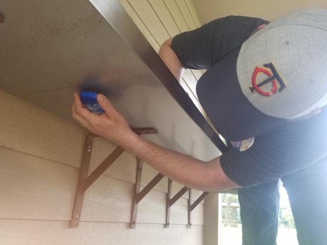 Neil Branstad found the blue Water Carnival medallion attached to the underside of a metal shelf in the shelter at Elks Park.  Staff photo by Jeremy Jones