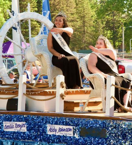 Miss Litchfield Cecilia Toenjes and Princess Abby Johnson wave to the crowd as they move down the route of the Litchfield Parade of Bands. Toenjes and Johnson will crown their successors during the Miss Litchfield coronation at 3 p.m. Sunday.