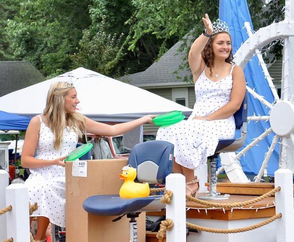 Princess Ellery Jones and Miss Litchfield Cecilia Toenjes road on the Watercade float during a parade last summer.  STAFF PHOTOS BY BRENT SCHACHERER