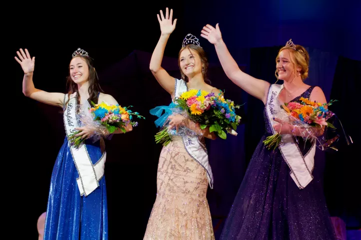 Princess Haylie Magoon, Miss Litchfield Claudia Toenjes and Princess Abagayle Shoutz flash broad smiles as they wave to the crowd at the conclusion of the royalty coronation.