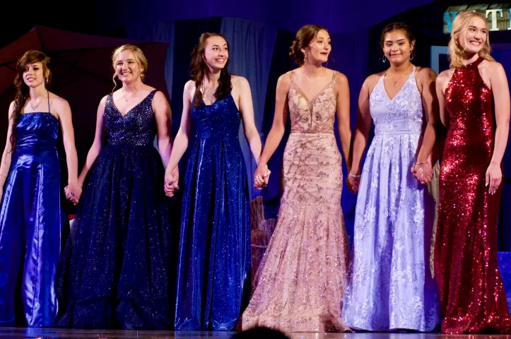 The six Miss Litchfield candidates hold hands as they wait anxiously for the crowning ceremony to begin.