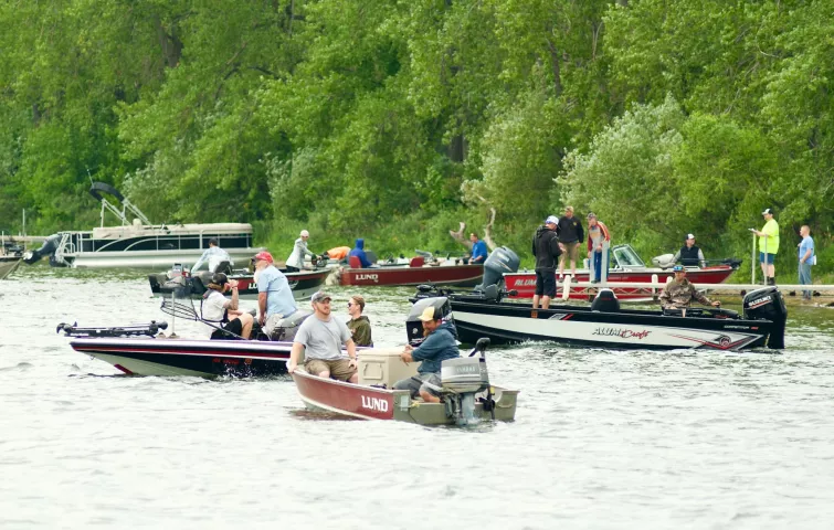 Boats wait near the shore for the start of the Watercade fishing contest Saturday morning.