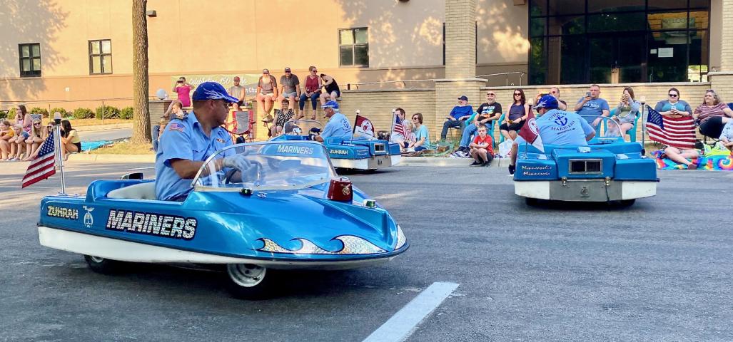 Zurah Shriners entertained people along the parade route by zipping around the street in various formations.
