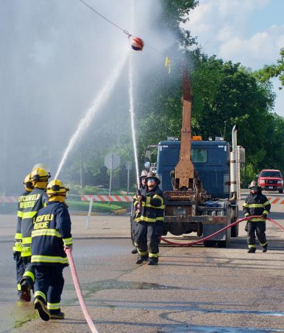 Teams representing the Litchfield Rescue Squad and Litchfield Fire Department squared off in the water ball competition Friday afternoon in front of the fire and rescue hall.