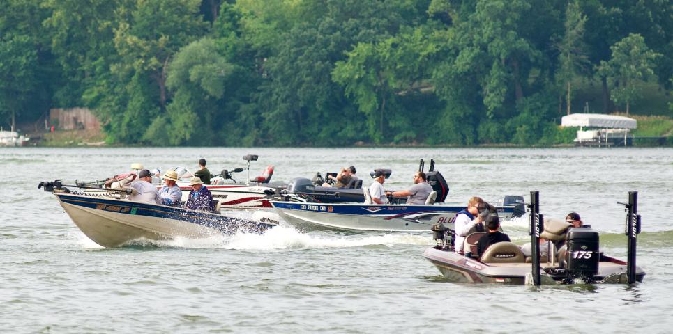 A boat heads out from the staging area after its number is called Saturday morning on Lake Ripley at the start of the Litchfield Watercade fishing tournament.