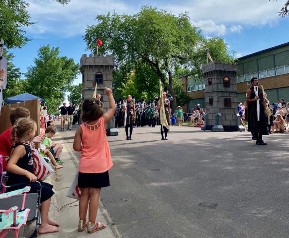 Youngsters waited with excited anticipation for the Litchfield High School marching band to begin its show on North Armstrong Avenue Saturday afternoon during the Grand Day Parade.