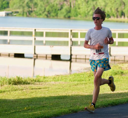 August Swenson set a fast pace and won with a big cushion in Saturday's 4-mile run. STAFF PHOTOS BY BRENT SCHACHERER