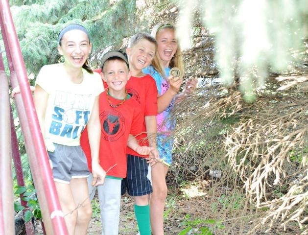 Alexis Hansen, Jack McCann, Logan King and Sydney McCann discovered the Watercade medallion, which was hidden in a group of pine trees behind the Fire and Rescue building.