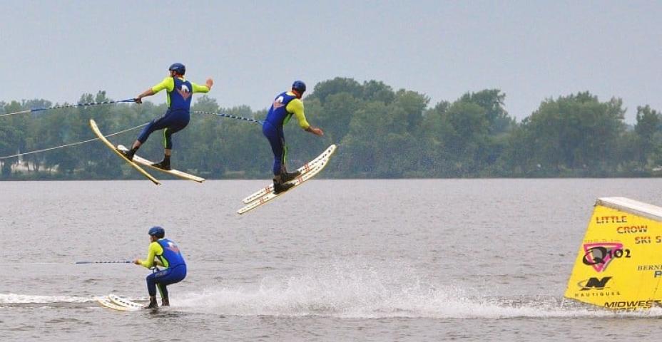 Members of the Little Crow Ski Team get some air Sunday during the ski show at Lake Ripley beach.