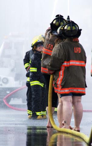 Litchfield Rescue women's team and Litchfield Fire Department women's team face off in the first round during the water ball fight Friday at the Litchfield Fire and Rescue building on North Ramsey Avenue.