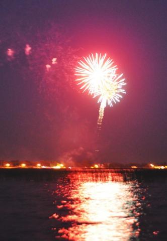 Bright fireworks cast a glowing trail of light across Lake Ripley during the Watercade firework display Friday night.