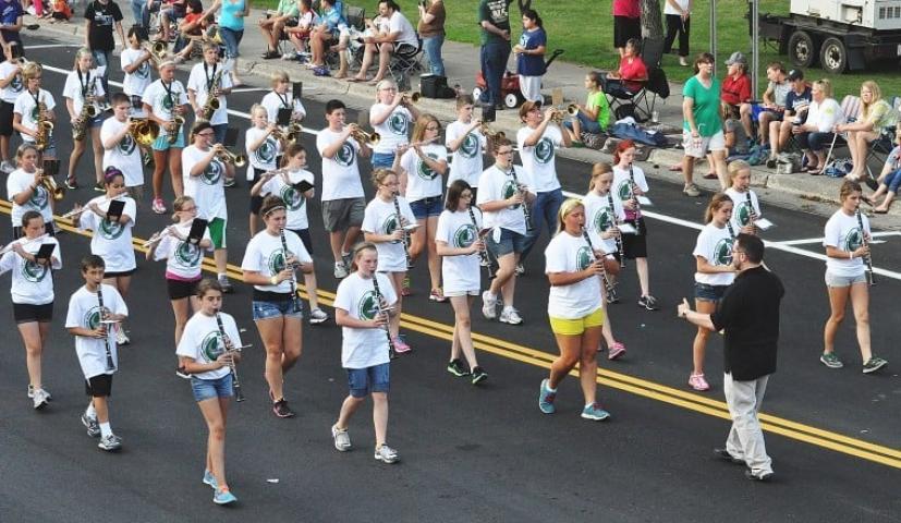 Litchfield Middle School band students form a marching band under the direction of John Twernbold for the Watercade Grand Day Parade on Saturday.