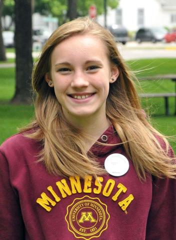 Marlaina Mahlow, 13, wears the 2014 Watercade button, which features her design.