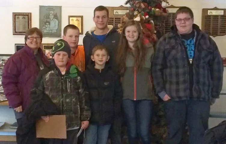 Mary Carlson, teacher of the deaf and hard of hearing at Litchfield School District, stands with current and former Litchfield students while visiting Camp Confidence in February. Pictured are, from left, front, third-grader Vincent Lee and fourth-grader Logan Maine; back, Carlson, sixth-grader Riley Swanson, junior Carter Janorschke, 2014 graduate Erika Hart and sophomore Bailey Snabb.