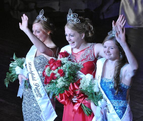 Newly crowned Litchfield royalty wave to the audience at Sunday’s coronation. Ali Richardson, center, was named 2014-2015 Miss Litchfield. New princesses are Emily Schreiber, left, and Erika Hart.