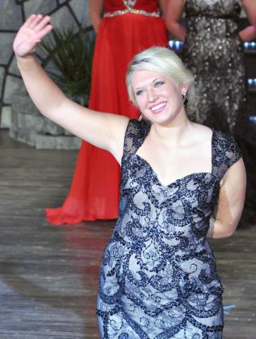 Miss Litchfield candidate Madison Westphal waves to the audience at coronation Sunday night. Westphal won the formal gown award at coronation.