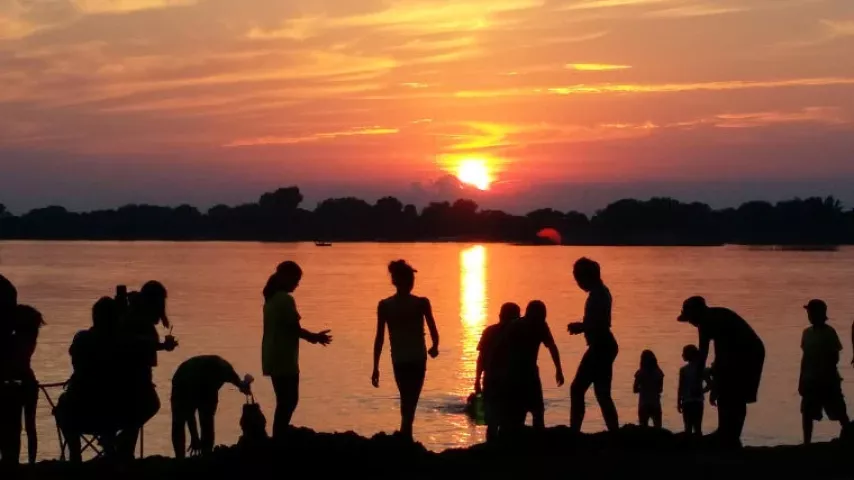 Beachgoers at Lake Ripley on Friday enjoy a gorgeous sunset before the fireworks started.
