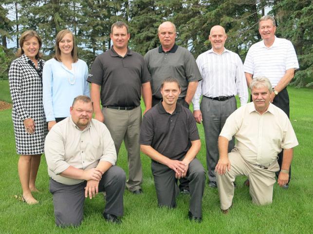 Sparboe Farms employees — who are being honored as this year’s Watercade grand marshal — stand in front of the Litchfield Sparboe Farms office. Pictured, from left to right, front, are Dan Amundson, Craig Boesen and Ken Zachman; back, Sparboe Farms President Beth Schnell, Sara Elenkiwich, Mark Kellen, Michael Johnson, Steve Kosel and Senior Vice President Wayne Carlson.  SUBMITTED PHOTO