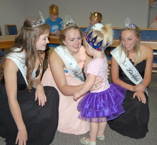 Litchfield royalty visited preschool story hour last August at Litchfield Public Library. Above, princess Erika Hart, Miss Litchfield Ali Richardson and princess Emily Schreiber, pictured from left to right, introduce themselves to children.