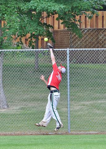 Riverside Tavern’s leftfielder Jordan Lecher nearly robbed a home run in his team’s first game of the 26-team Watercade softball tournament. Instead, the ball deflected off his glove and over the fence for a home run.