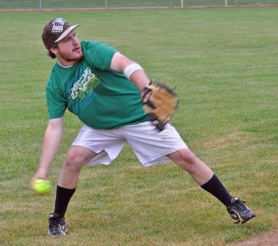 Riverside Tavern’s Kaleb Kalkbrenner, who also plays baseball for the Litchfield Blues, winds up to make a throw across the diamond on July 12 at the Watercade softball tournament.