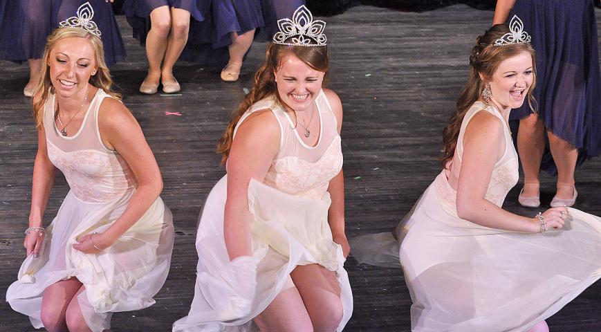 2014-2015 Litchfield royalty Emily Schreiber, Ali Richardson and Erika Hart have a Marilyn Monroe moment while dancing to “A Little Party Never Killed Nobody” during the July 11 coronation, marking the end of Litchfield's annual Watercade festival.