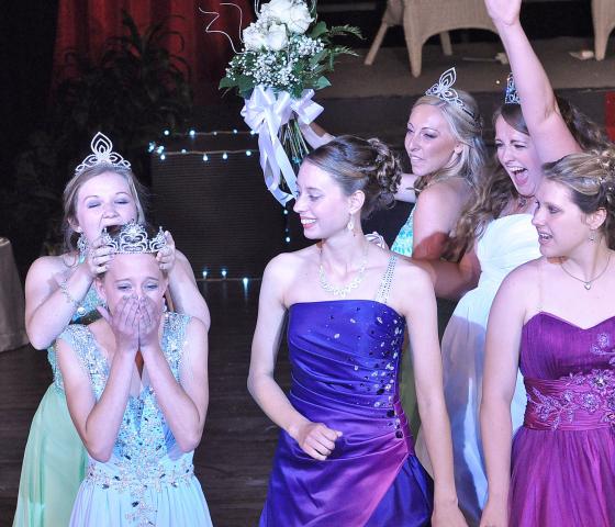 Erika Hart, 2014-2015 princess, places a crown on the head of Kaitlynn Beighley, a 2014 Litchfield High School graduate, at Sunday's coronation. Also pictured are, from left, candidate Megan Birch, 2014-2015 princess Emily Schreiber, 2014-2015 Miss Litchfield Ali Richardson and candidate Ruth Nygaard.