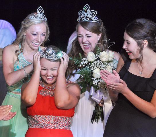 Newly crowned princess Autumn Raiber is all smiles as she feels the crown atop her head at coronation. Also pictured are, from left, 2014-2015 princess Emily Schreiber, 2014-2015 Miss Litchfield Ali Richardson and candidate Kaitlyn Lundin.