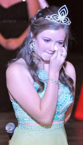 Outgoing princess Erika Hart wipes tears from her eyes while giving her farewell address at coronation.