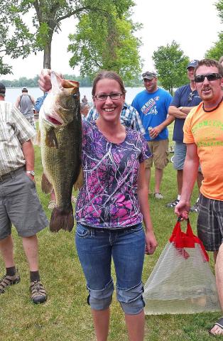 Casey Simmons holds a five pound, five ounce bass caught by Troy Simmons at Saturday’s 59th annual Watercade fishing contest on Lake Ripley. Simmons’ bass was the largest bass caught by any of the 34 boats that hit the water on Saturday.  Submitted Photo