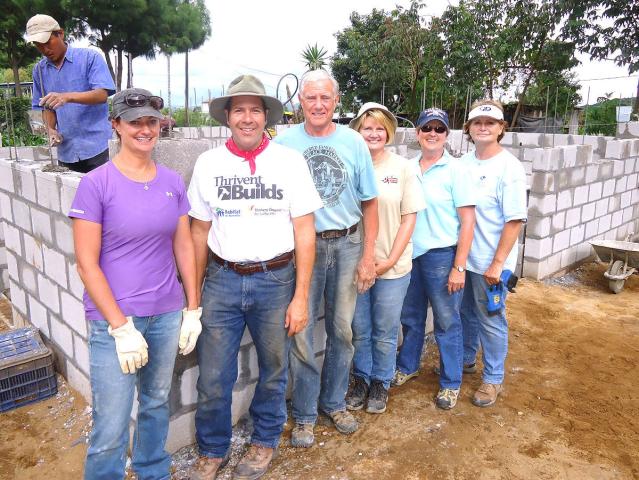 From left, Heather Jackson, Paul White, Bob Jackson, Cheryl Whitchurch, Janet Samson and Joyce Jackson stand in front of the foundation of a home they built while on a Thrivent Builds with Habitat for Humanity trip in 2013 in Panajachel, Guatemala.
