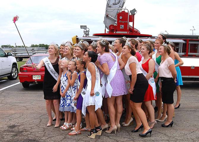 Miss Litchfield Karly Nelson and princess Autumn Raiber squeeze into a selfie photo with royalty from other towns at Winsted’s Summer Festival last year.