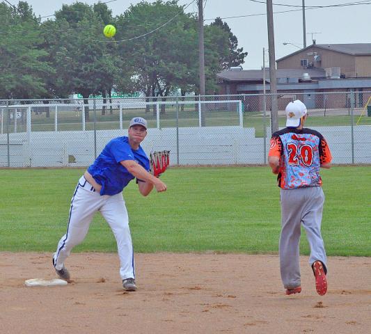 Royal Pains’ shortstop Ricky Doriott, of Blaine, turns a double play on Saturday. Royal Pains won three and lost two in the weekend’s tournament and were eliminated by KR Rockets, who took third place overall.