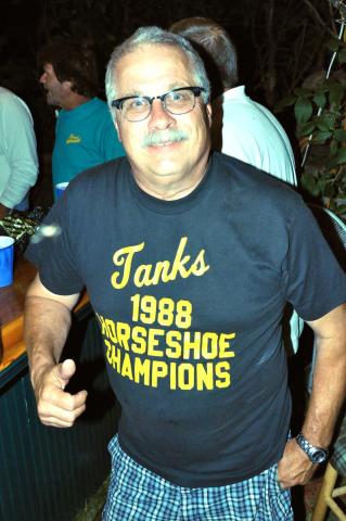 The Tanks have competed in many Watercade events over the years, including softball and golf. Paul Jaeger displays evidence of the group’s accomplishment in the 1988 horseshoe competition.