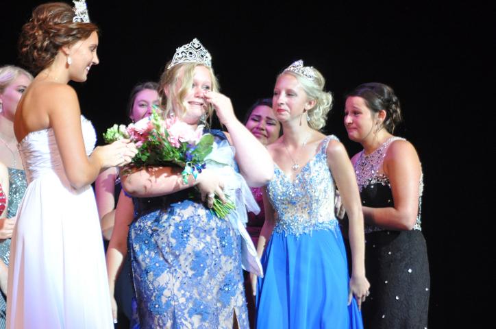Newly crowned Miss Litchfield Hailey Stoffer cried as former Miss Litchfield Karly Nelson hands her her bouquet of flowers.