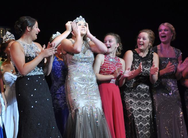 Princess Justine Madsen clutches her crown in disbelief. Madsen was the first of the royalty to be crowned at Sunday's coronation.