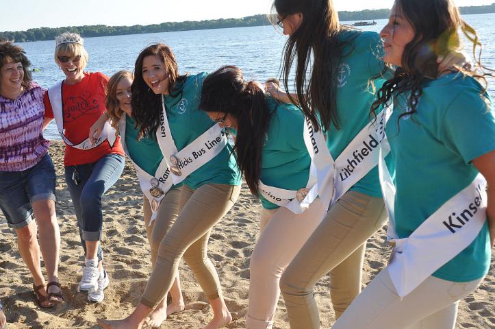 Watercade candidates dance with Litchfield residents at Friday night's beach party on the shores of Lake Ripley.