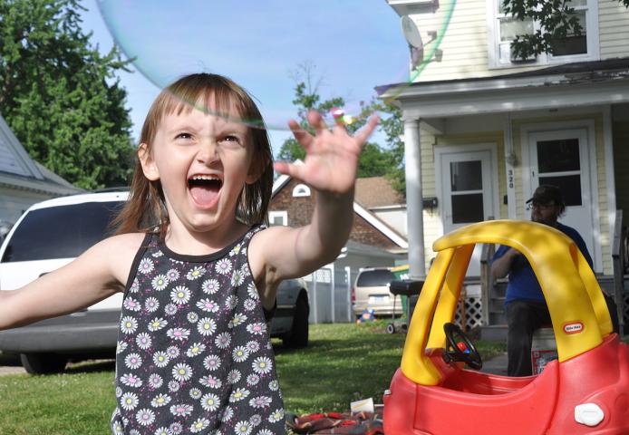 Katie Rogers chased bubbles at last year’s Grand Day Parade.
